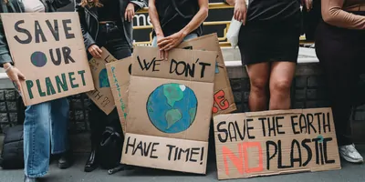 Protestors against climate change and environmental damage. holding cardboard signs