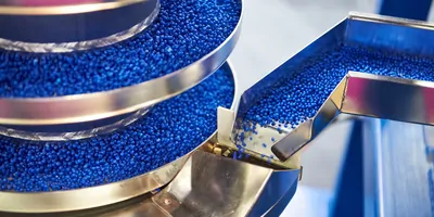 Plastic recycling plant, with plastic pellets on a conveyor