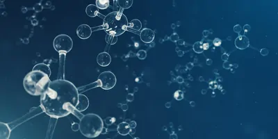 Glass molecule models on a blue background