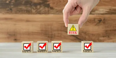 Human's hand getting rid of risk block