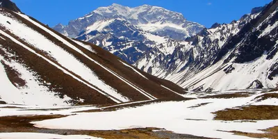 Snowcapped Mount Aconcagua and glacier lake