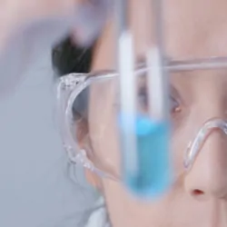 a close up of a scientist in the lab performing gc-ms testing