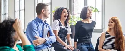 Cheerful multi-ethnic business colleagues in meeting