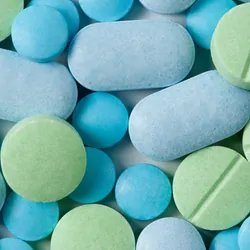 Blue and green medicine tablets 