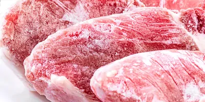 Raw frozen meat. raw pork chops