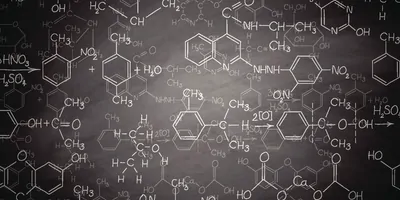 Organic Chemistry equations on a black board