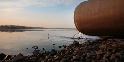 Photo of a sewer pipe dumping into a river