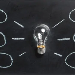 Lightbulb with bubbles abstract concepts surrounding it