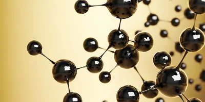 Black balls attached to represent atomic bonds on a yellow background