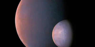 A large planet and its moon in space
