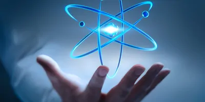 Holographic image of an atom floating over a human hand