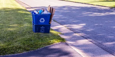 Recycling bins on the side of the road