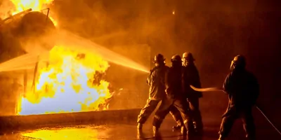 Fire fighters putting out an industrial fire