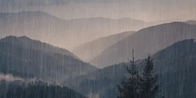 A mountain range in the rain