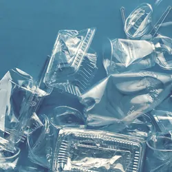 Various plastic packaging products on a blue background