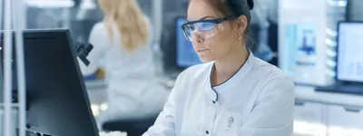 Scientist works at a computer