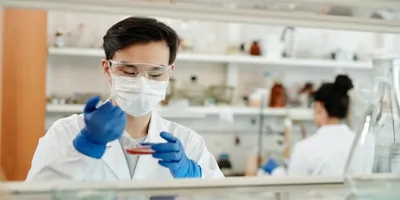 People working in a lab wearing PPE