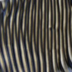 MIT engineers observed that a liquid crystal’s orderly microstructures will spontaneously assemble into large, twisted structures when the liquid is made to slowly flow.