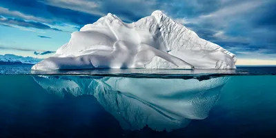 Iceberg half above water, half below
