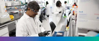 Multiple scientists working at the lab bench