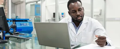 Scientist uses an electronic lab notebook on his laptop