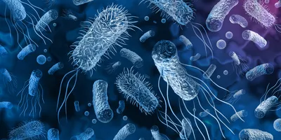 3d rendering of various bacteria in different shades of blue all on a blue background