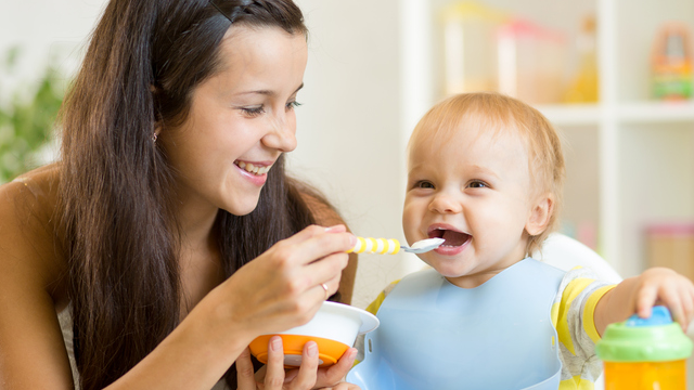 mom feeding baby