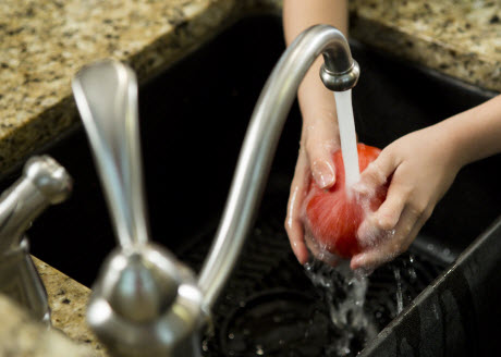 Washing a tomato