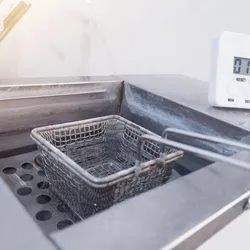 image of a laboratory oil bath with lifting basket emphasizing the importance of safe use in the laboratory