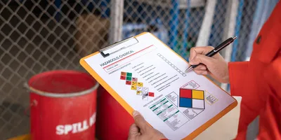 safety inspector with chemical safety checklist emphazing the importance of chemical spill prevention and safety in the laboratory
