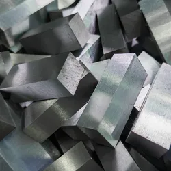 Stacked metallic alloy bars highlighting innovations in materials science and engineering
