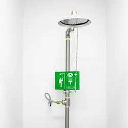 an overhead safety shower and emergency eye wash station in a laboratory