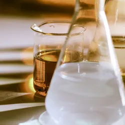 a flask of cloudy liquid sitting on a lab bench illustrating the concelt of turbidity meter measurement and calibration