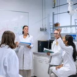 a group of scientists engaged in internal team training as opposed to external certification