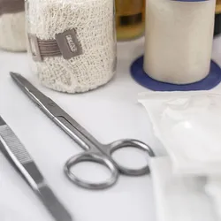 Medical tools and supplies on a white surface, symbolizing advancements in materials science, including a self-healing hydrogel that mimics human skin.