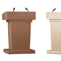 Two wooden debate podiums next to each other against a white background
