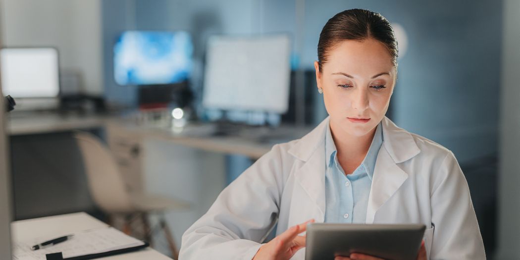 Scientist analyzing data on a tablet Scientist analyzing data on a tablet