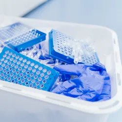 laboratory waste bin showing various gloves and plasticware illustrating the importance of establishing a zero-waste mindset