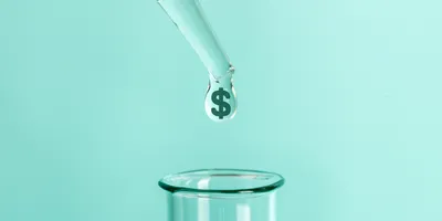 pipette dripping liquid into a test tube, the liquid shows a doallr sign it it symboloc if the comcept of the cost of lab safety