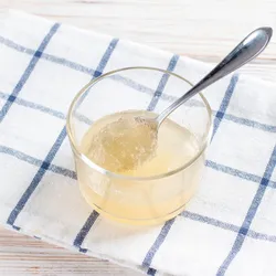 a glass bowl with a clear plant-based gelatin substance in it