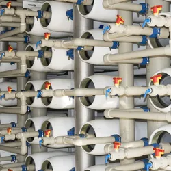 A wide shot of valves and tubes in a water desalination plant