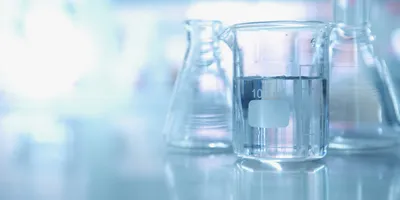 A picture of clean glassware, symbolic of the use of a laboratory glassware washer.