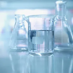 A picture of clean glassware, symbolic of the use of a laboratory glassware washer.