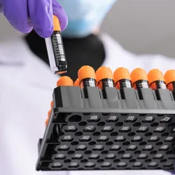 Researcher using FluidX Tubes