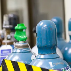 Compressed gas cylinders secured within a laboratory setting for gas safety and lab safety compliance