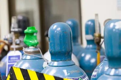 Compressed gas cylinders secured within a laboratory setting for gas safety and lab safety compliance