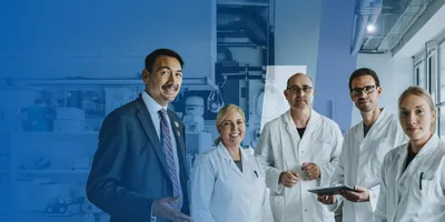 A group of smiling scientists