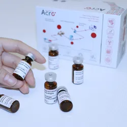 Hand holding a vial of ADC internalization reagent, a pH-sensitive red fluorescent dye that labels the human IgG Fc region. 