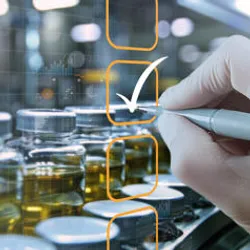 Gloved hand using a stylus to mark a checklist overlaid on a background of pharmaceutical vials filled with liquid on a production line.