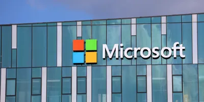 A wide shot of the Microsoft sign outside a glass-walled office building